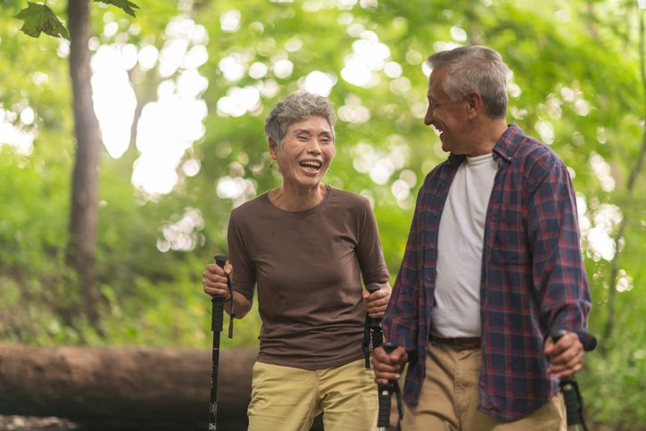 A elderly couple on a hike after choosing the best funeral insurance to keep their family's future secured.