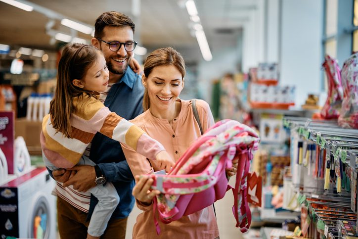 Family with small child goes shopping together with extra financial security of term assurance.